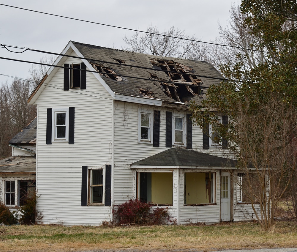 a house with trees in the background