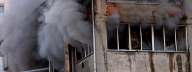 A Steam Train On A Track With Smoke Coming Out Of It