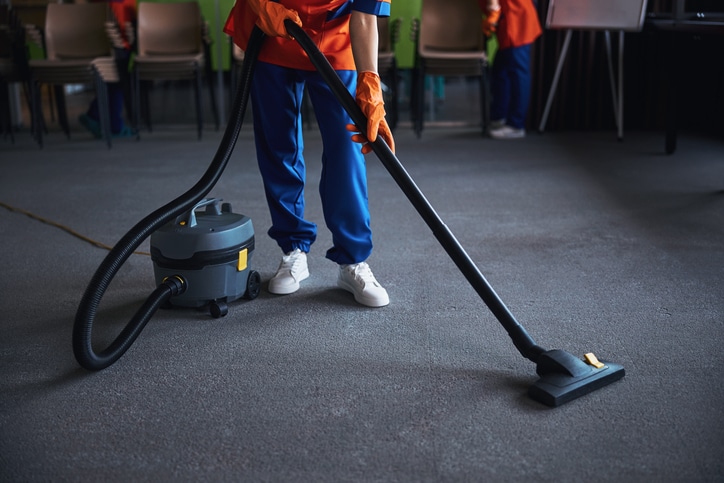 An image of someone cleaning the carpeting in a care facility.